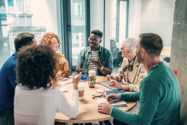Shot of a group of businesspeople sitting together in a meeting