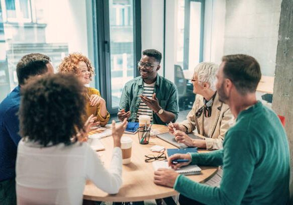 Shot of a group of businesspeople sitting together in a meeting